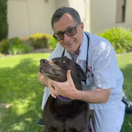 Dr. Lee Fausett with a dog